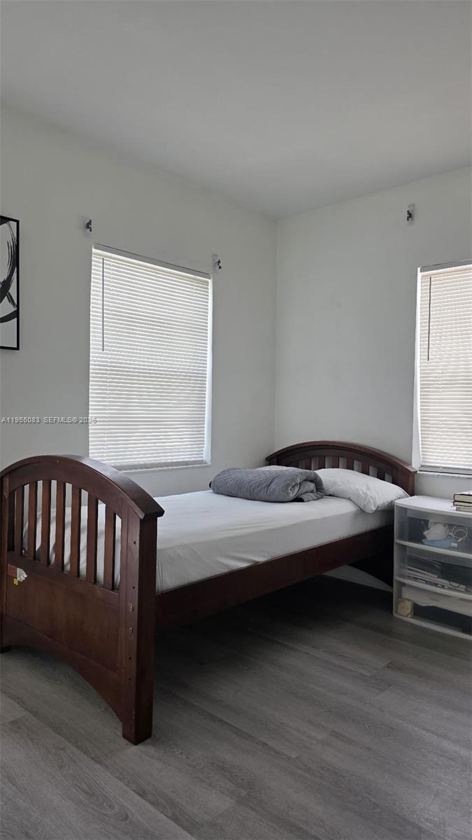 2729 Northwest 47th Street Miami, FL 33142 - Photo 22 of 34 a bedroom with a bed and a window