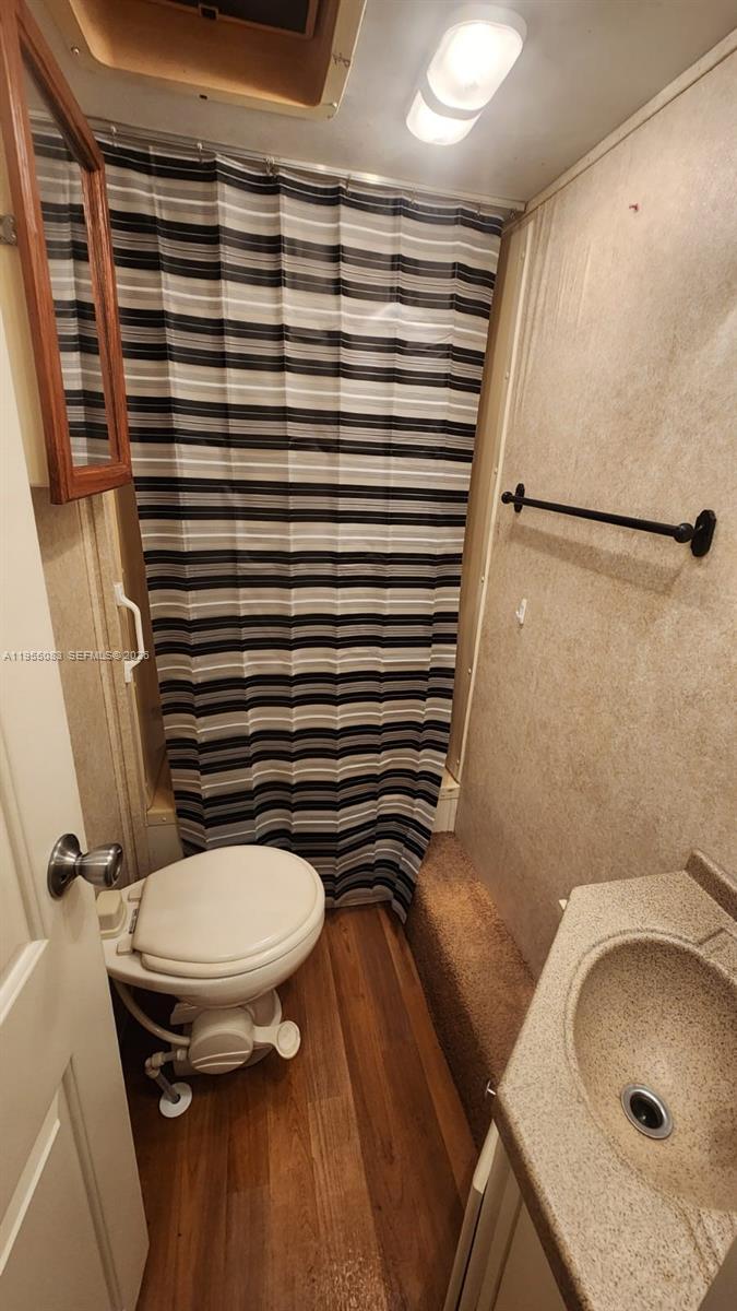 2729 Northwest 47th Street Miami, FL 33142 - Photo 27 of 34 a bathroom with a sink and a toilet