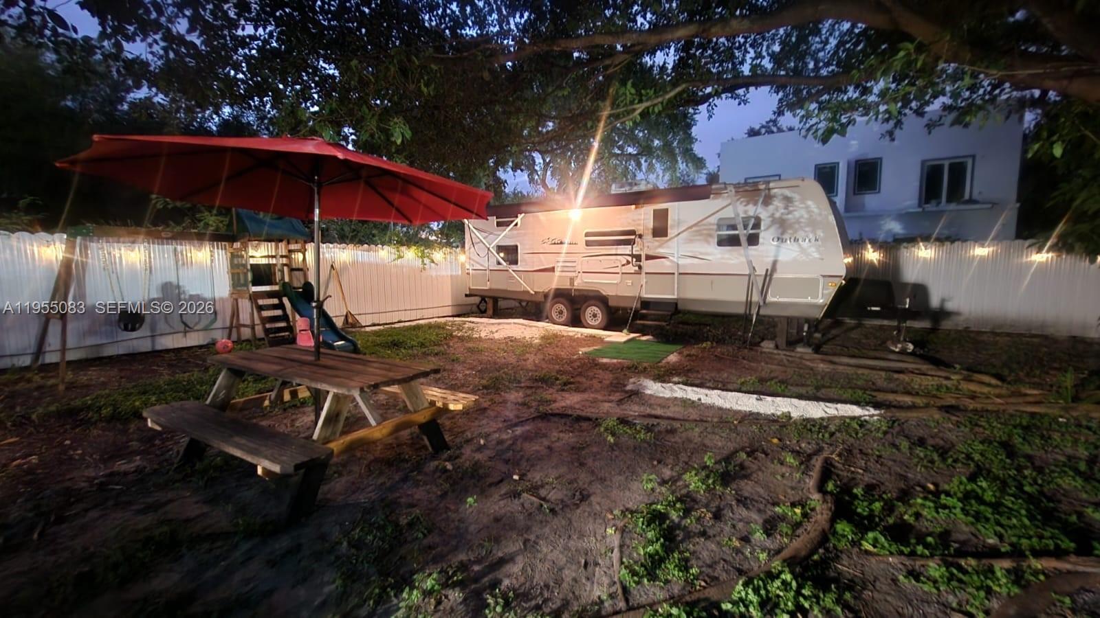 2729 Northwest 47th Street Miami, FL 33142 - Photo 28 of 34 a view of a backyard with sitting area