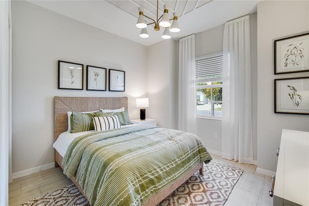 7165 Inlet Isles Lakewood Ranch, FL 34202 - Photo 17 of 26 a bedroom with a bed and a window