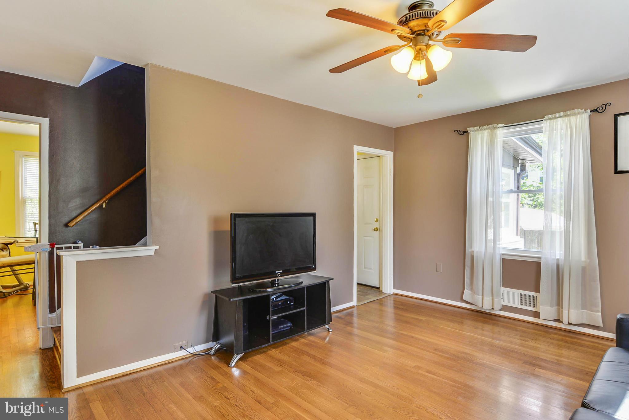 2707 Weisman Road Silver Spring, MD 20902 - Photo 15 of 30 a living room with furniture and a flat screen tv