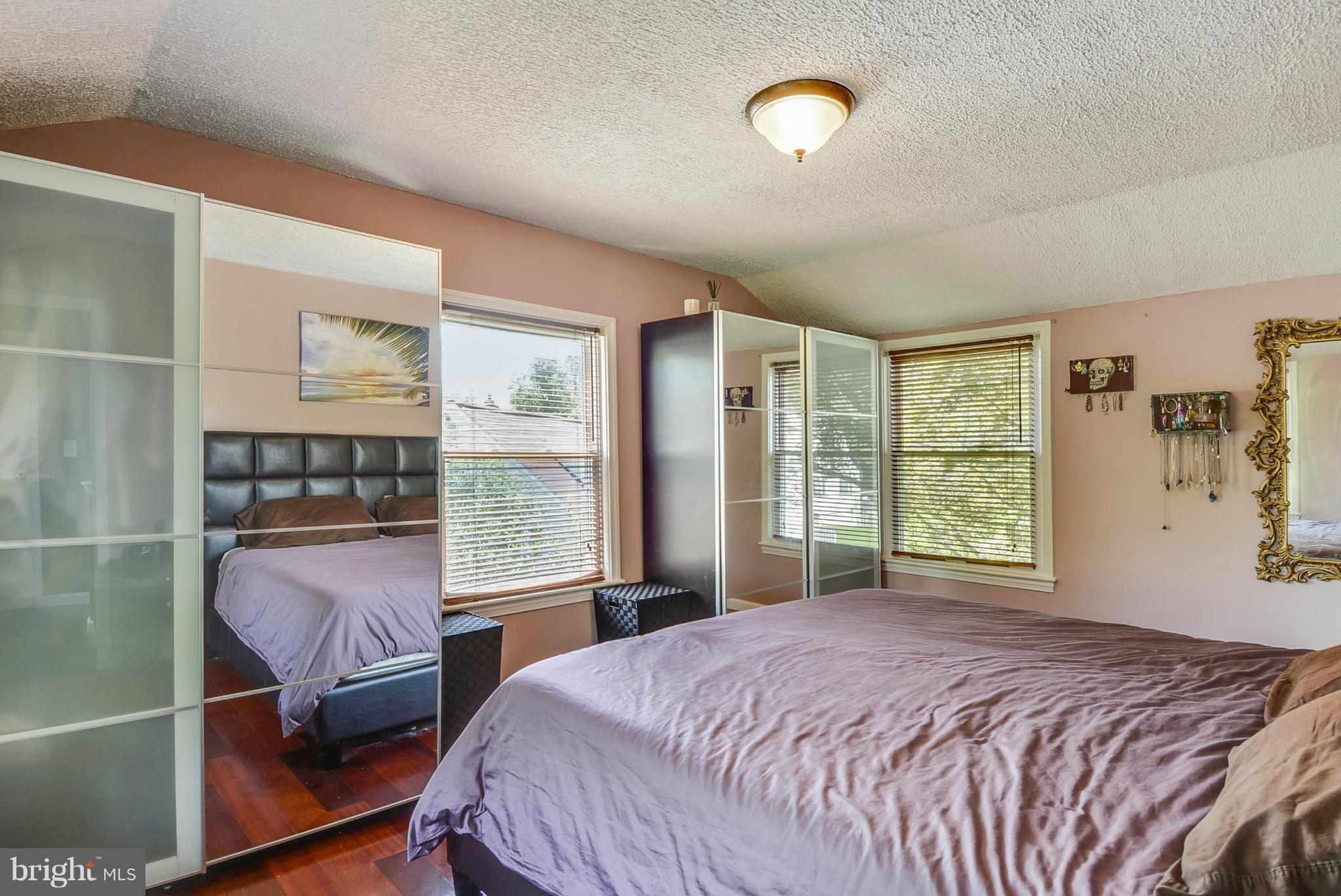 2707 Weisman Road Silver Spring, MD 20902 - Photo 17 of 30 a bedroom with a large bed and a window