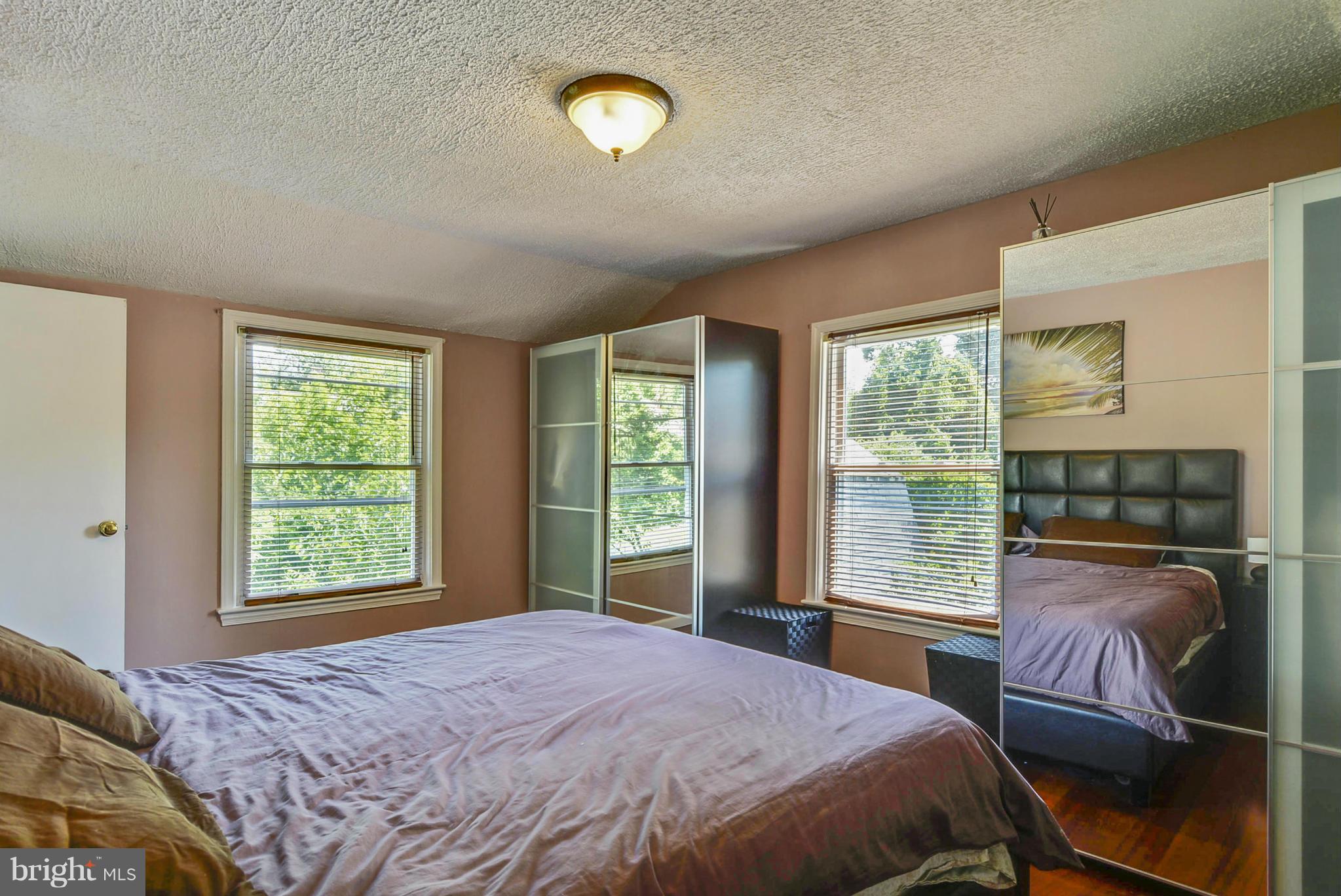 2707 Weisman Road Silver Spring, MD 20902 - Photo 19 of 30 a bedroom with a bed and a large window