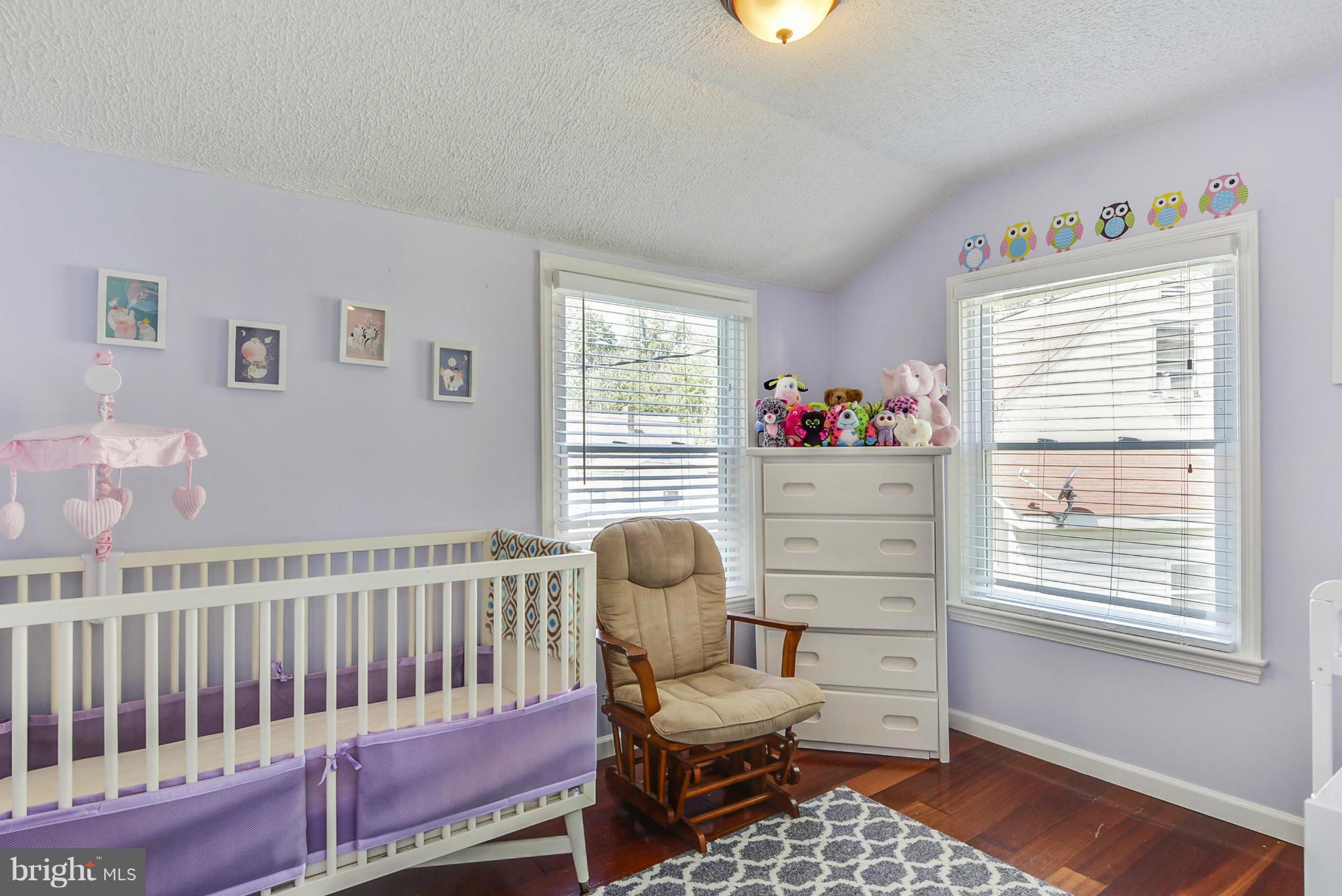 2707 Weisman Road Silver Spring, MD 20902 - Photo 20 of 30 a bedroom with furniture and a window