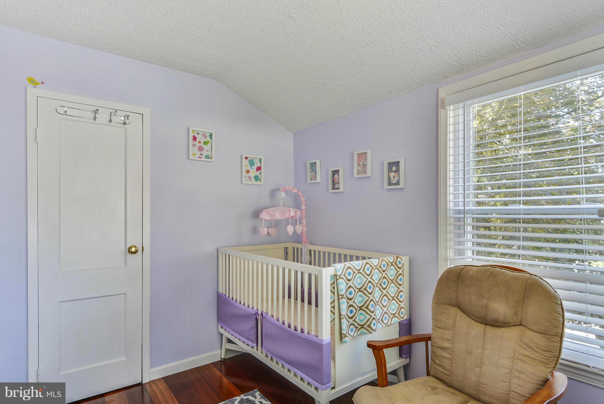 2707 Weisman Road Silver Spring, MD 20902 - Photo 21 of 30 a bedroom with a bed and window