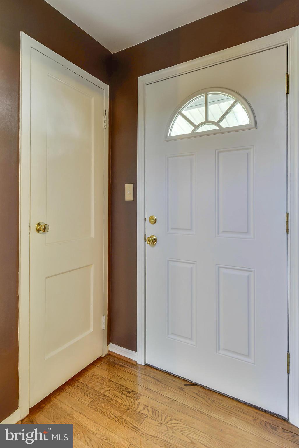 2707 Weisman Road Silver Spring, MD 20902 - Photo 7 of 30 an empty room with a window and a hallway