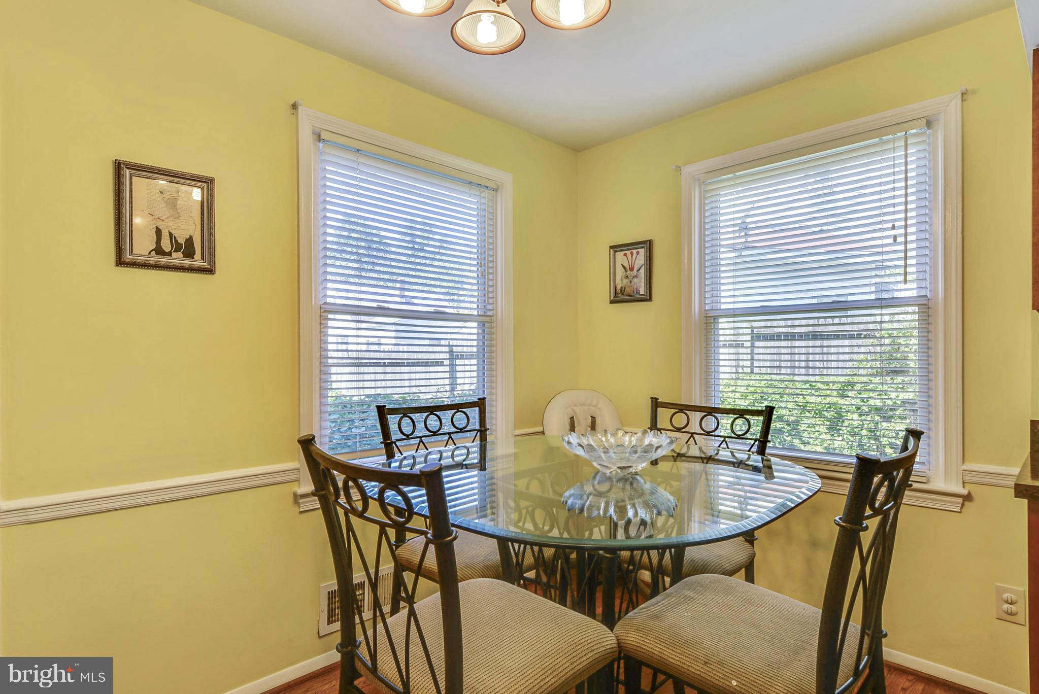 2707 Weisman Road Silver Spring, MD 20902 - Photo 8 of 30 a view of a dining room with furniture and window