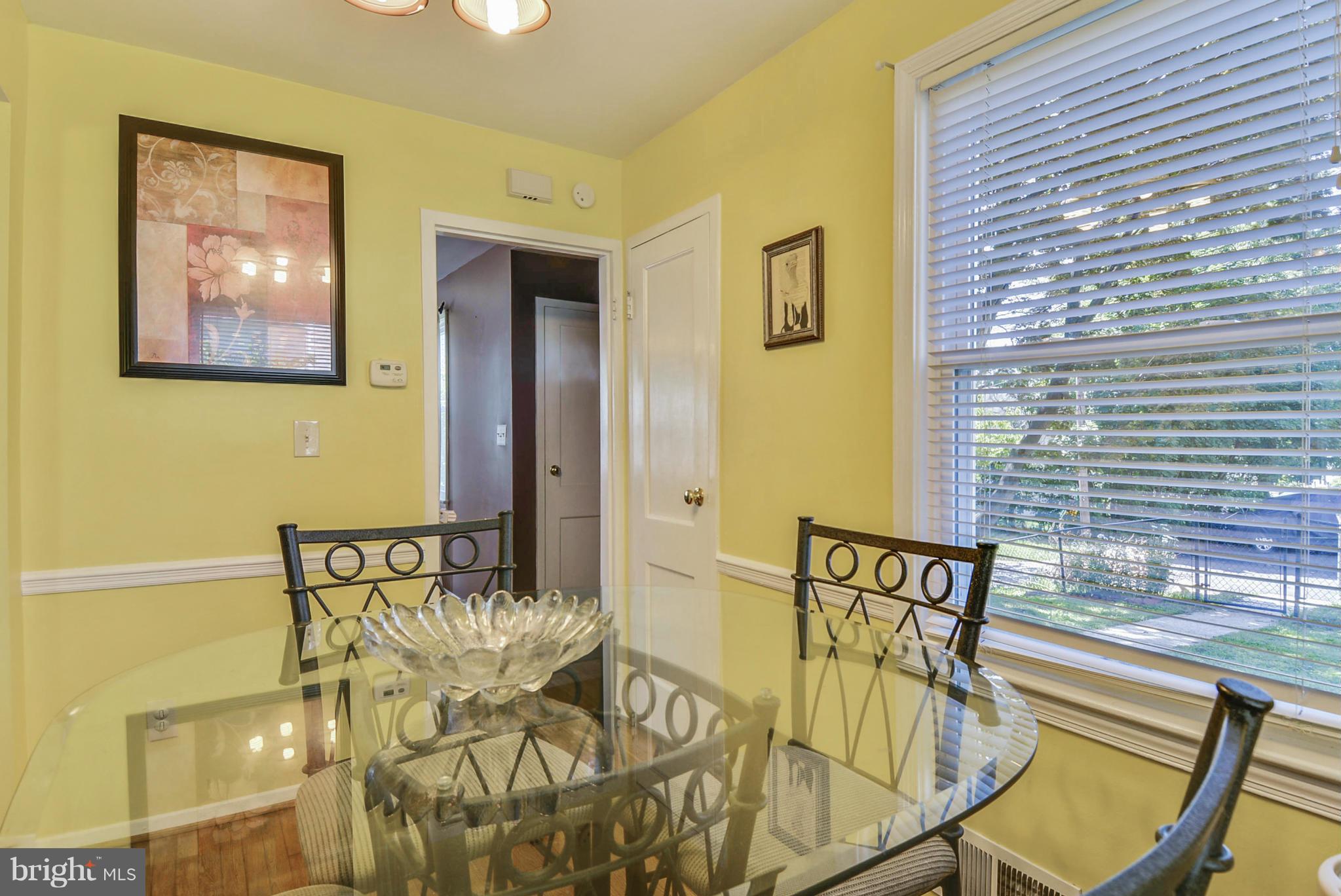 2707 Weisman Road Silver Spring, MD 20902 - Photo 10 of 30 a view of a dining room with furniture and wooden floor
