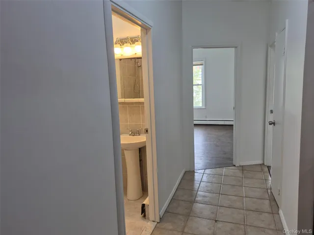a view of an entryway and wooden floor