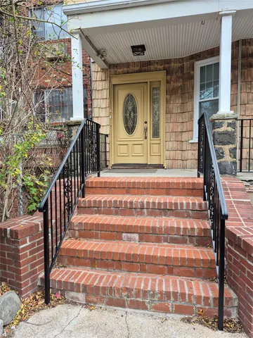 a front view of a house with large windows