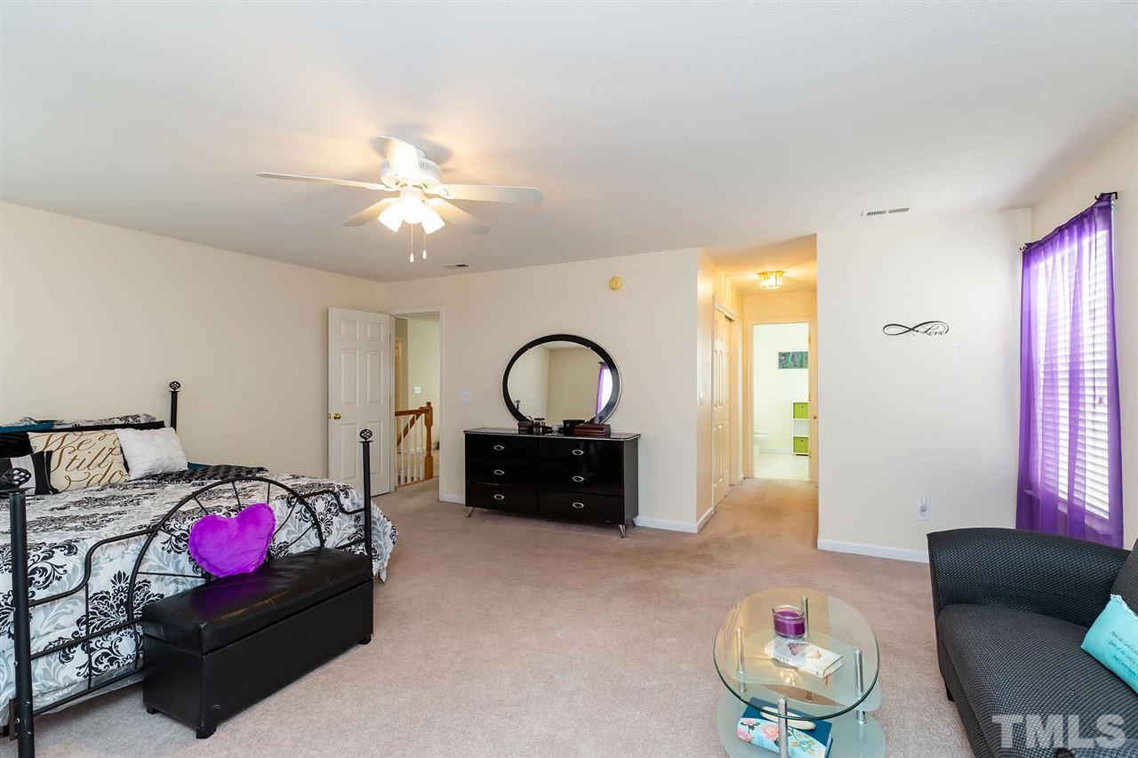 4316 Snowcrest Lane Raleigh, NC 27616 - Photo 22 of 29 a living room with furniture and a wooden floor