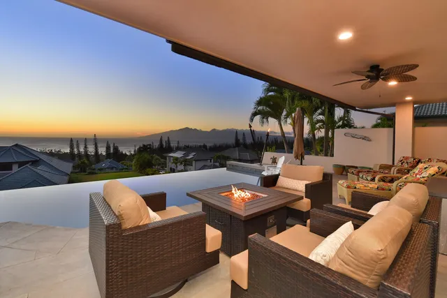 a outdoor living space with furniture and city view