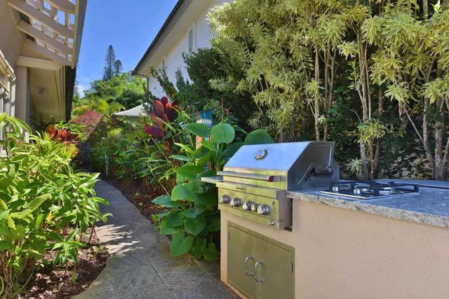 a utility room with dryer and trees