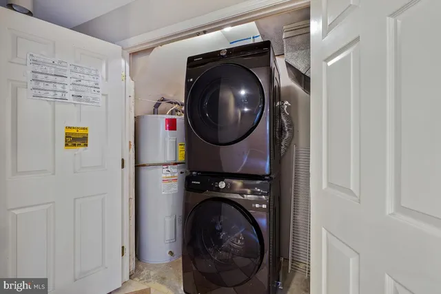 a living room with fireplace furniture and a wooden floor