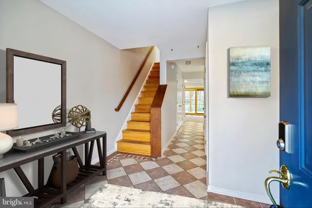 a view of an entryway with wooden floor