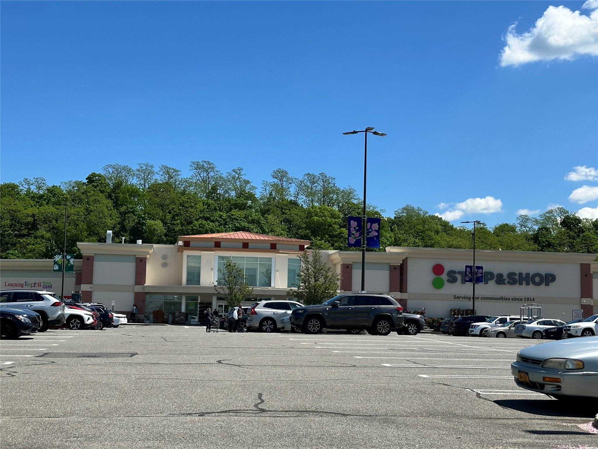 13 Linwood Road South Port Washington, NY 11050 - Photo 3 of 8 a view of a car parked on the side of a road