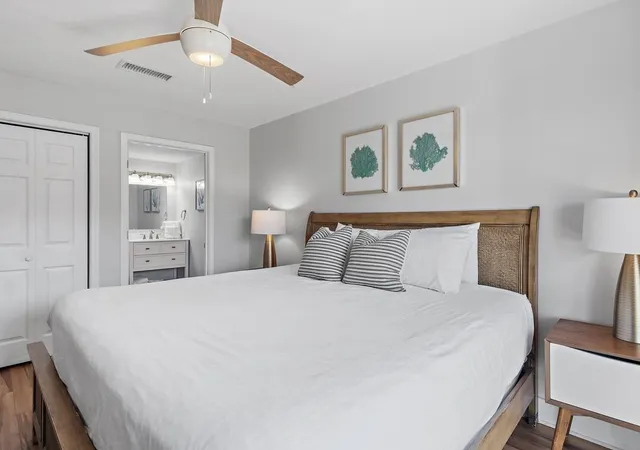 a bathroom with a sink a toilet and shower curtain