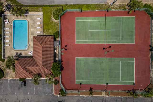 an aerial view of a house with a garden