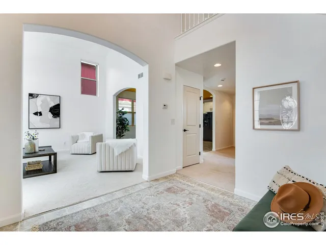 a kitchen with kitchen island granite countertop a sink cabinets and stainless steel appliances