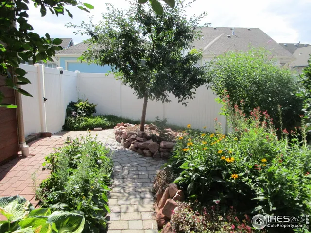 a view of backyard with seating space