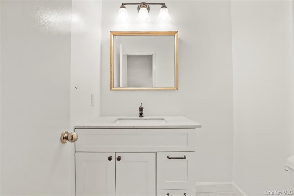 41 Rambling Brook Road Chappaqua, NY 10514 - Photo 15 of 29 Bathroom with vanity, toilet, and baseboards