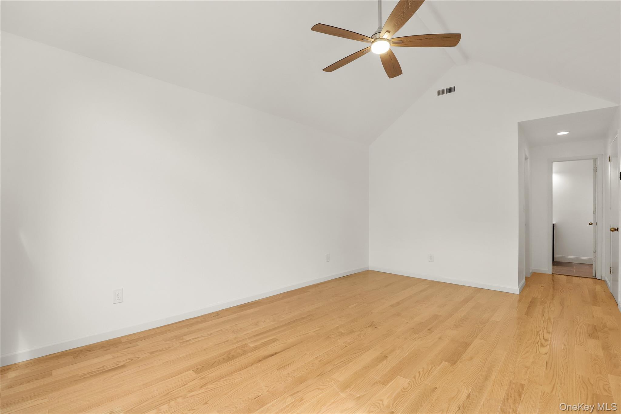 41 Rambling Brook Road Chappaqua, NY 10514 - Photo 17 of 29 Unfurnished room with ceiling fan, lofted ceiling, light wood-style flooring, baseboards, and recessed lighting