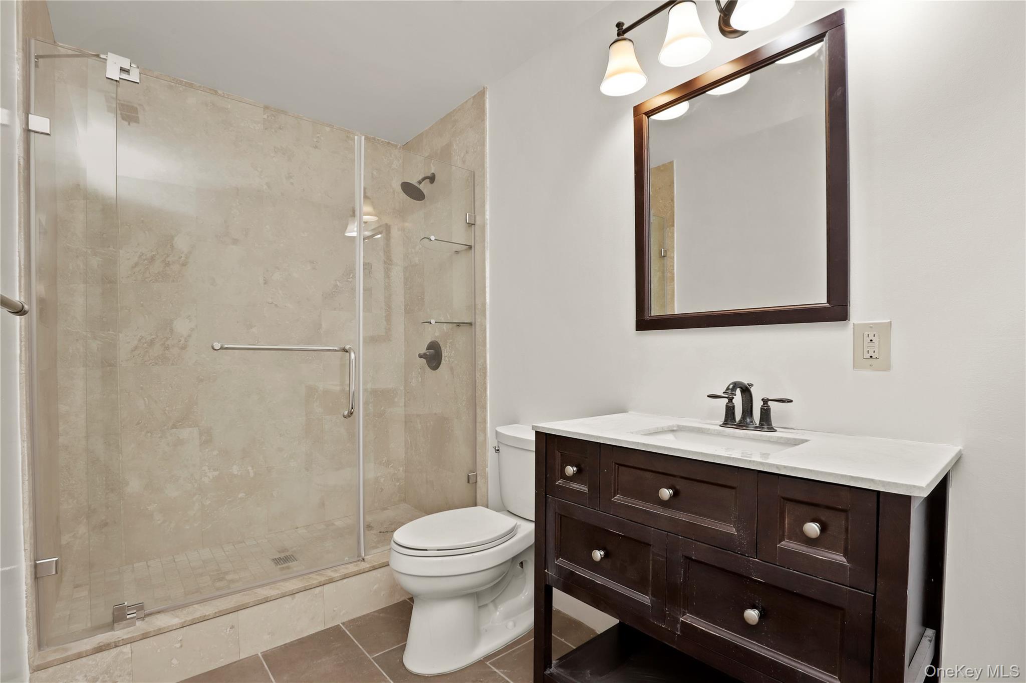 41 Rambling Brook Road Chappaqua, NY 10514 - Photo 19 of 29 Full bathroom featuring toilet, a stall shower, vanity, and tile patterned floors