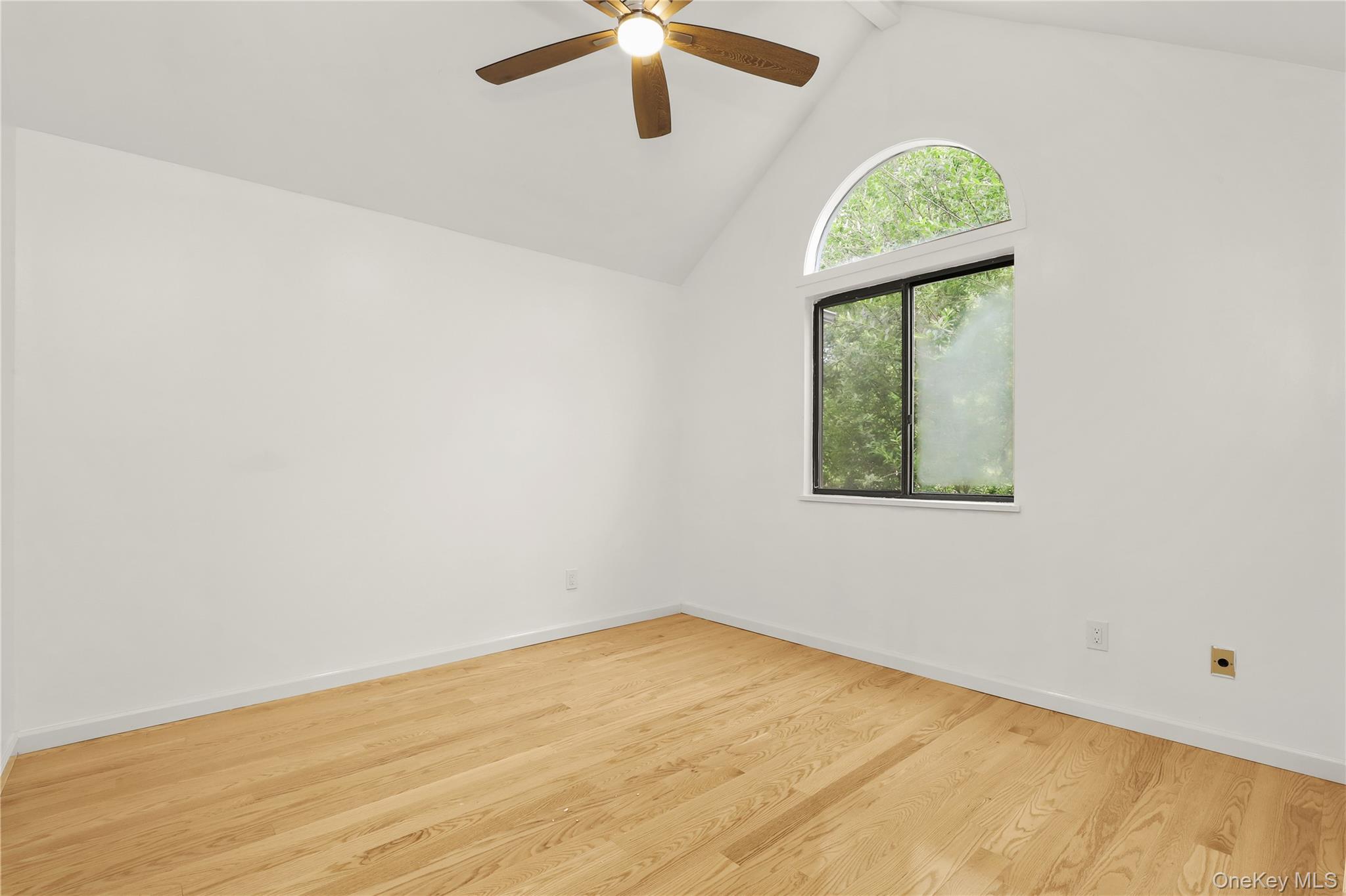 41 Rambling Brook Road Chappaqua, NY 10514 - Photo 20 of 29 Unfurnished room with ceiling fan, wood finished floors, baseboards, and high vaulted ceiling