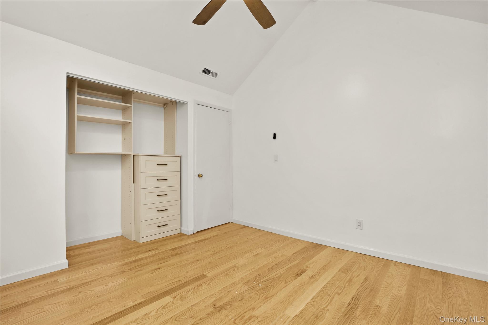 41 Rambling Brook Road Chappaqua, NY 10514 - Photo 21 of 29 Unfurnished bedroom featuring vaulted ceiling, light wood finished floors, baseboards, and ceiling fan