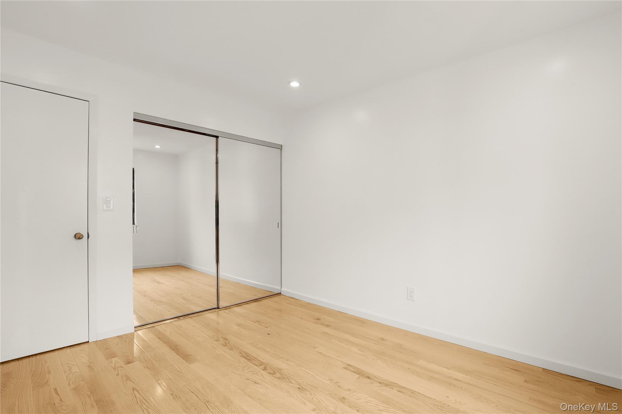41 Rambling Brook Road Chappaqua, NY 10514 - Photo 22 of 29 Unfurnished bedroom featuring wood finished floors, a closet, baseboards, and recessed lighting