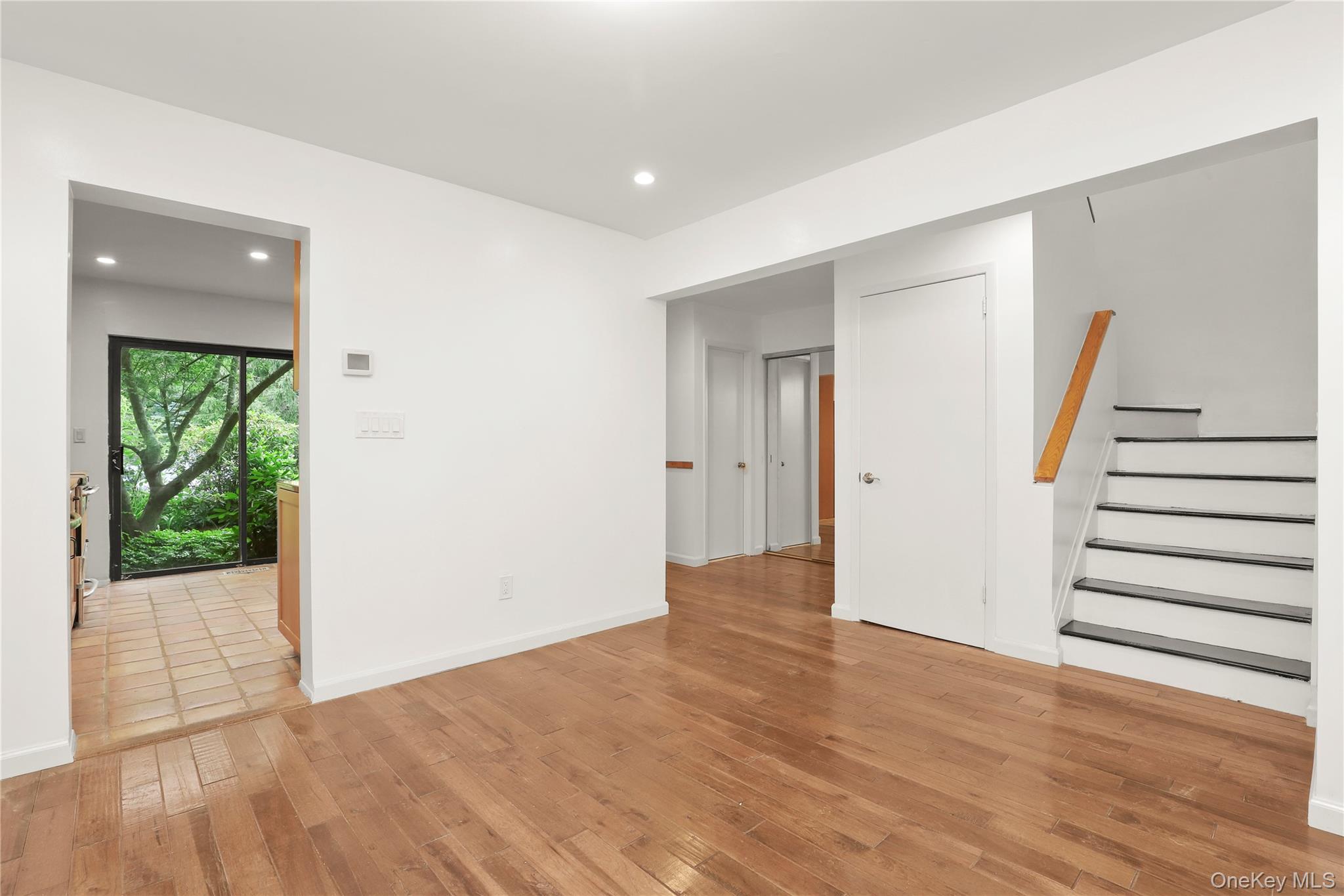 41 Rambling Brook Road Chappaqua, NY 10514 - Photo 3 of 29 Empty room featuring light wood finished floors, stairway, recessed lighting, and baseboards