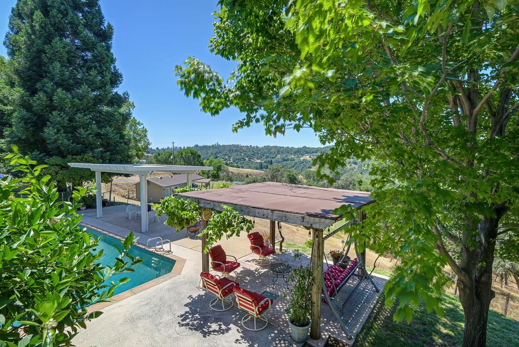 7630 Ridge Road Newcastle, CA 95658 - Photo 62 of 85 Resort-style built-in pool with multiple covered outdoor entertaining areas. Expansive poolside pavilion. Shaded outdoor lounge area. Panoramic valley, hills and pasture views. Incredible sunset views.