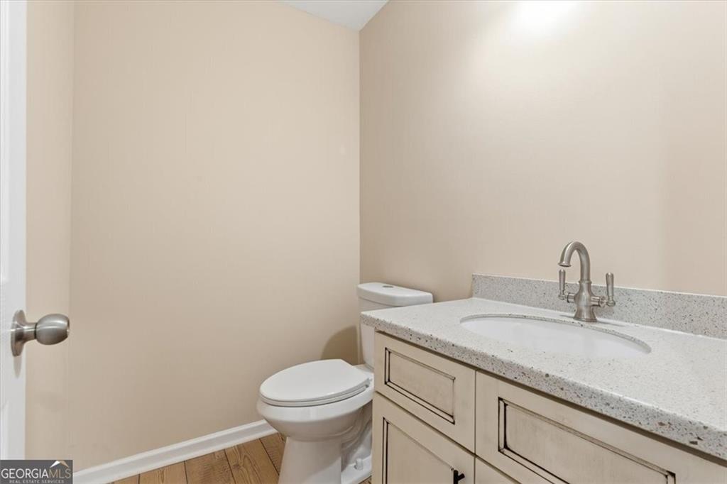 279 Taff Road Taylorsville, GA 30178 - Photo 25 of 36 a bathroom with a granite countertop toilet and sink