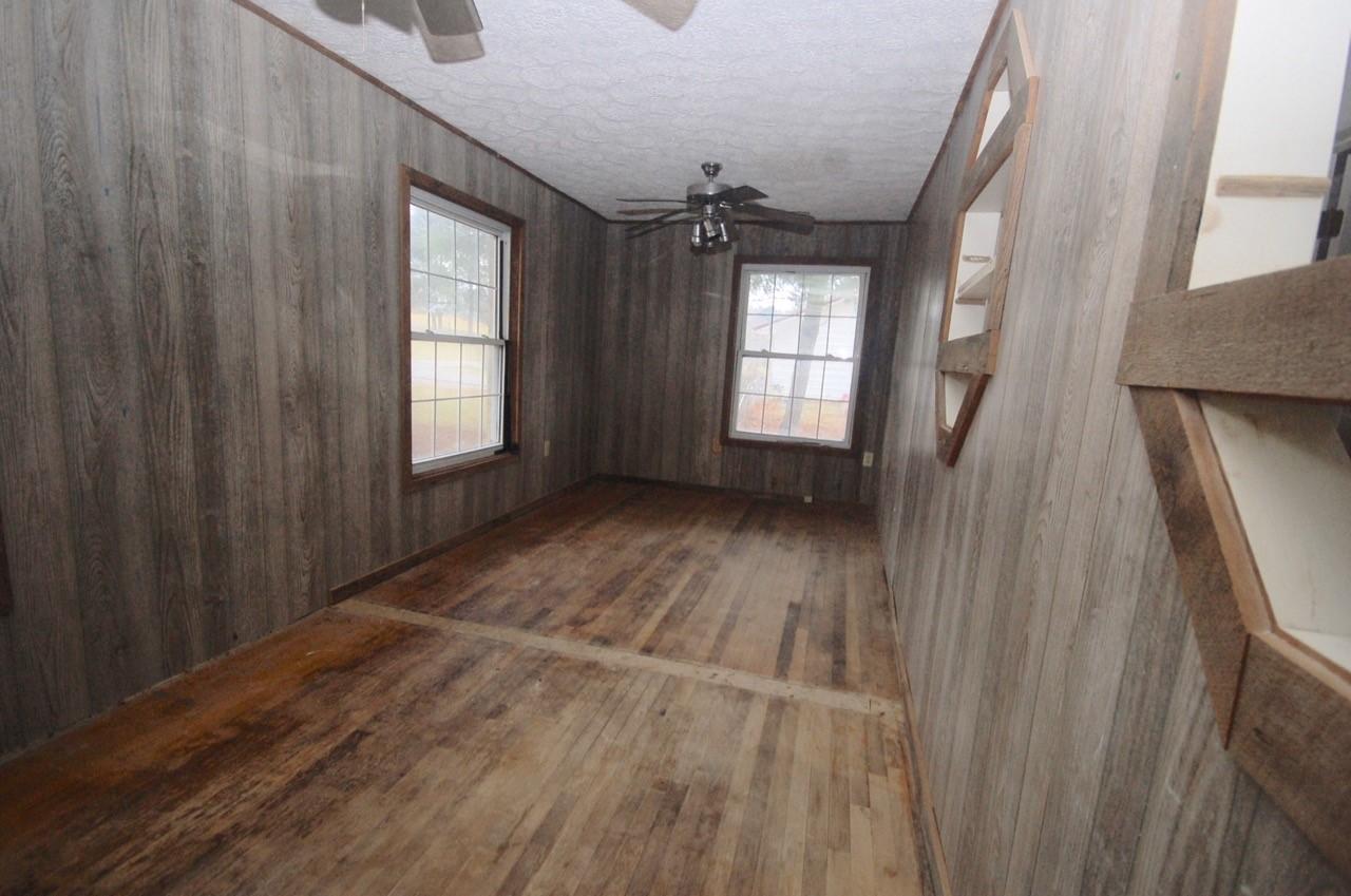 4488 Old Pike Road Pilot, VA 24138 - Photo 16 of 19 a view of an empty room with wooden floor and a window