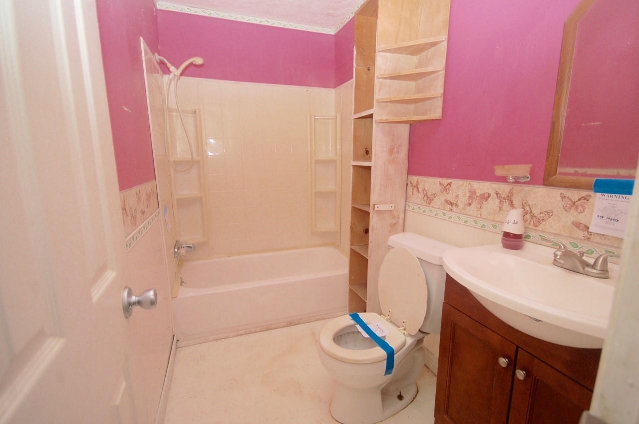 4488 Old Pike Road Pilot, VA 24138 - Photo 17 of 19 a bathroom with a sink a toilet and shower