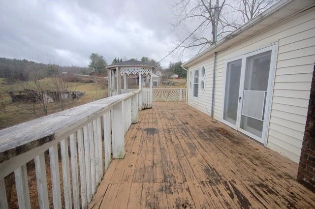 4488 Old Pike Road Pilot, VA 24138 - Photo 4 of 19 a view of a balcony with wooden floor and fence