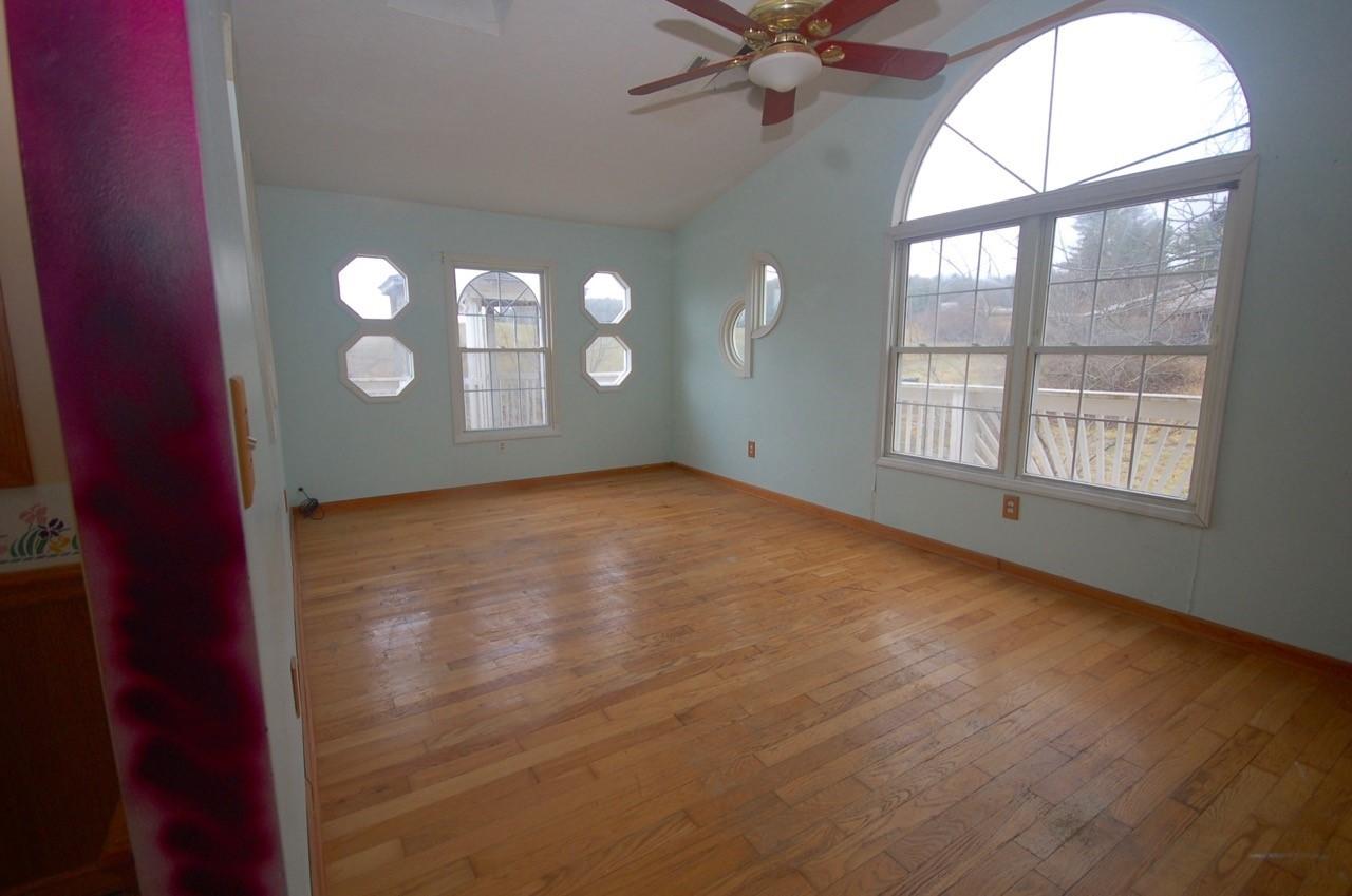 4488 Old Pike Road Pilot, VA 24138 - Photo 7 of 19 an empty room with windows and entrance