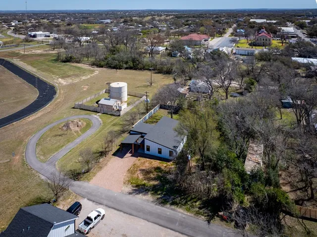 an aerial view of a house with outdoor space