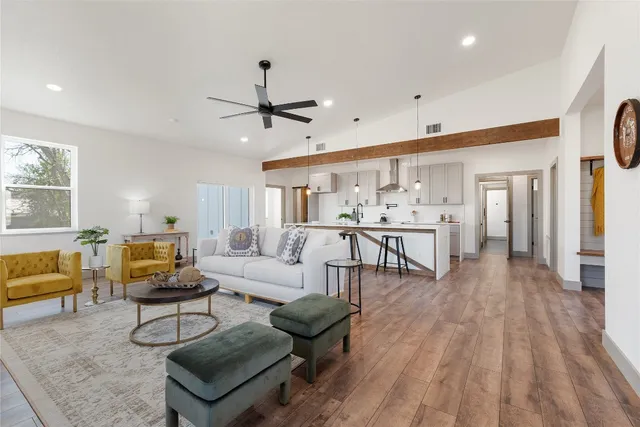 a view of an entryway with wooden floor and windows