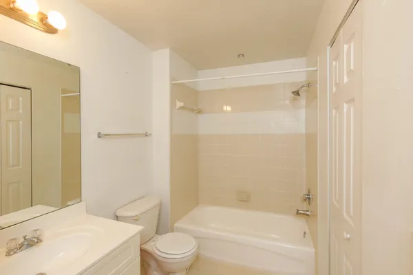 a view of a room with wooden floor and closet