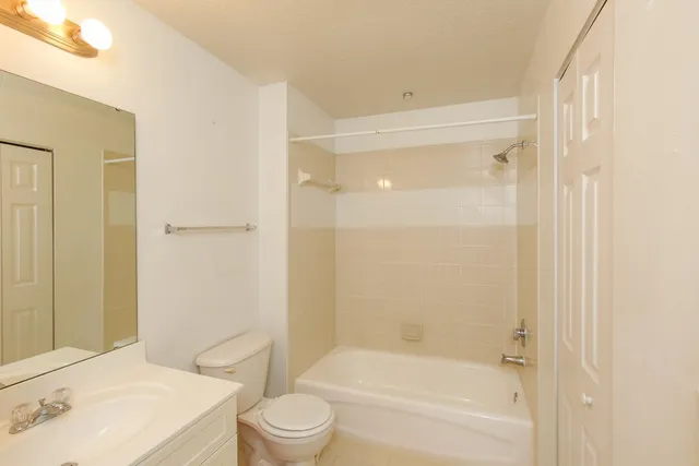 a view of a room with wooden floor and closet