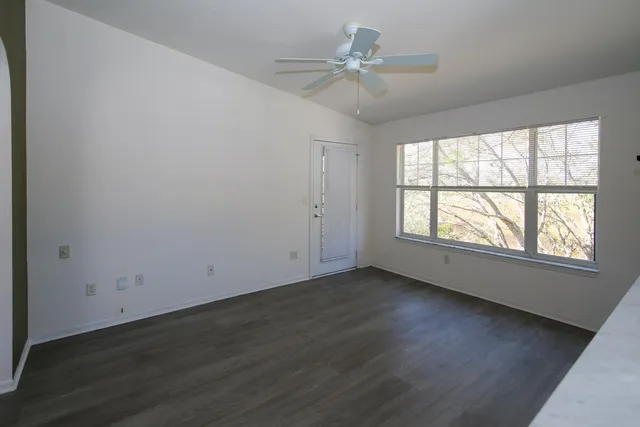 a view of a kitchen from a hallway