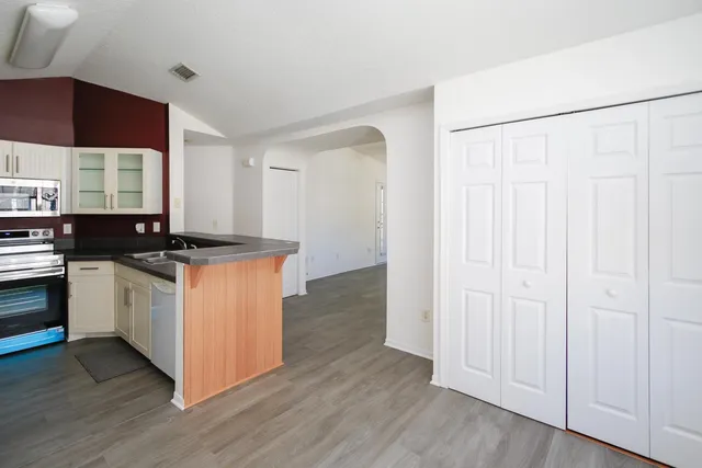 a kitchen with a sink and a microwave