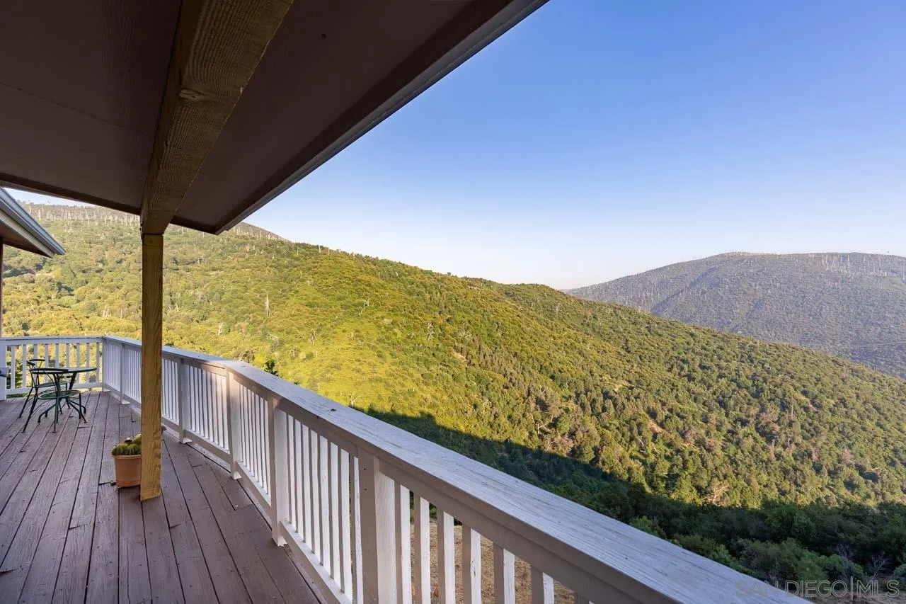 8048 High Hill Road Julian, CA 92036 - Photo 23 of 30 a view of a balcony with wooden floor and fence