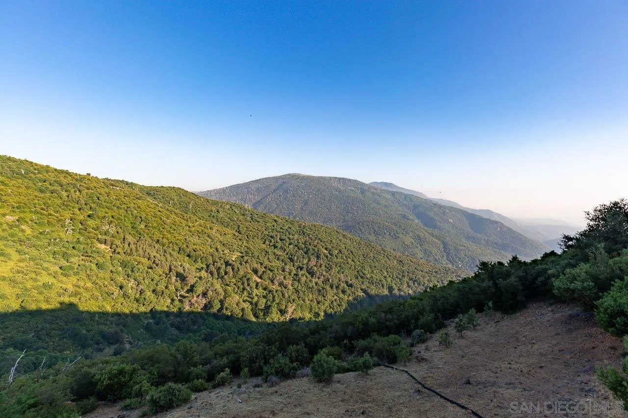 8048 High Hill Road Julian, CA 92036 - Photo 29 of 30 a view of a dry yard with mountains in the background