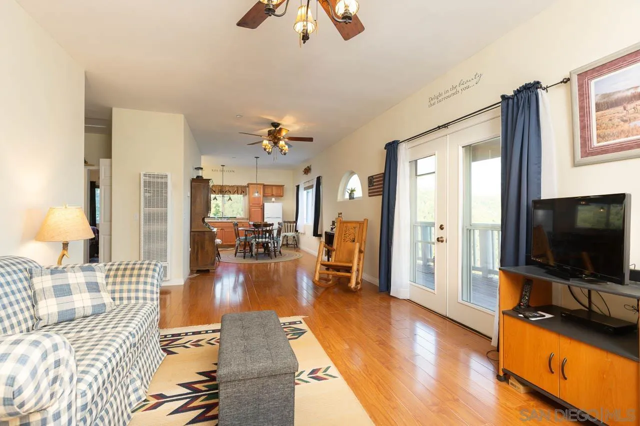 8048 High Hill Road Julian, CA 92036 - Photo 7 of 30 a living room with furniture and a flat screen tv
