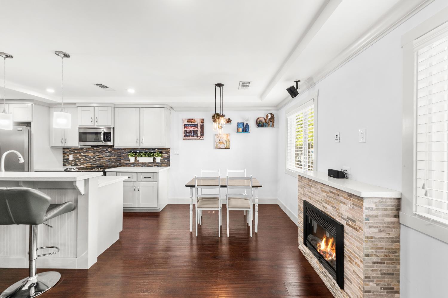 10835 Coloma Road, Unit 3 Rancho Cordova, CA 95670 - Photo 12 of 31 a kitchen with a white cabinets and wooden floor