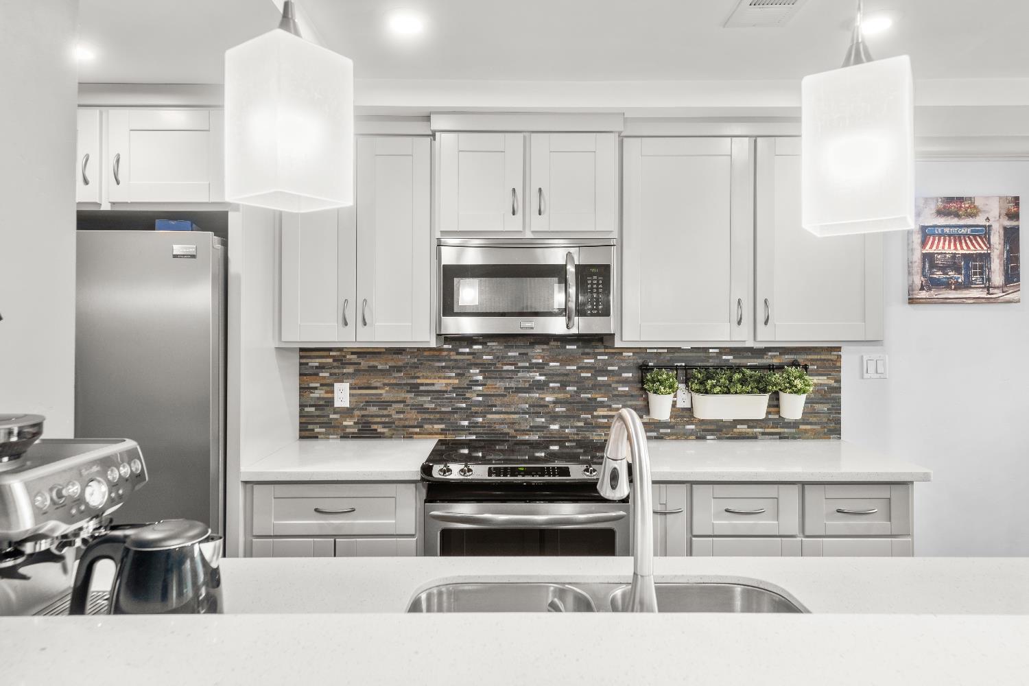 10835 Coloma Road, Unit 3 Rancho Cordova, CA 95670 - Photo 16 of 31 a kitchen with stainless steel appliances granite countertop a stove and a refrigerator
