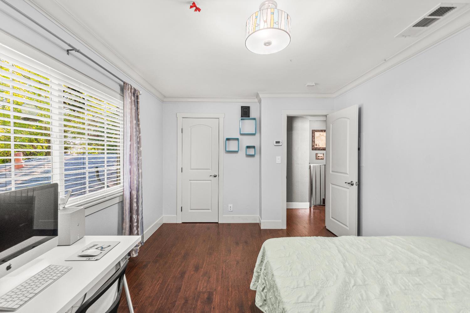 10835 Coloma Road, Unit 3 Rancho Cordova, CA 95670 - Photo 23 of 31 a bedroom with a bed and a flat screen tv