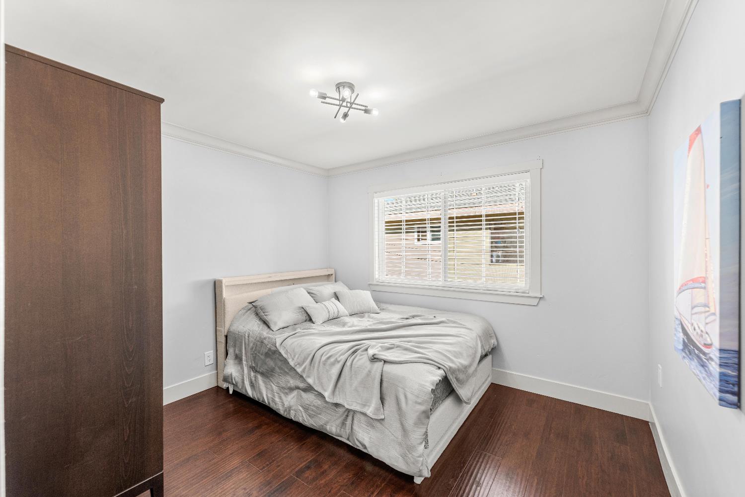 10835 Coloma Road, Unit 3 Rancho Cordova, CA 95670 - Photo 24 of 31 a bedroom with a bed and a window